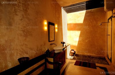 Java Moon - warm-toned bathroom with window light streaming across textured walls
