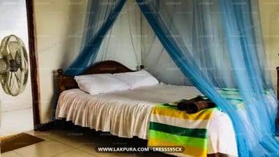 Cloud Nine Lanka Resort - four-poster bed with blue canopy drapes and colorful blanket
