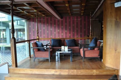 Earl's Regency - modern lounge with burgundy wallpaper and mid-century furniture