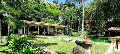 Java Moon - wooden lodge with open veranda overlooking tropical garden and lawns