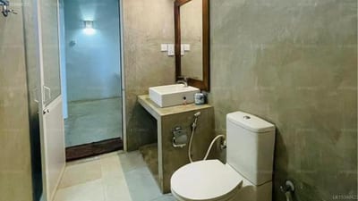 Birdwing - bathroom with toilet, sink, and shower stall