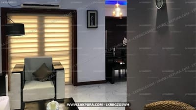 Hideout Colombo - modern lounge with illuminated wall panels and upholstered chair