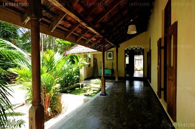 Java Moon - covered walkway with tropical plants and wooden beams