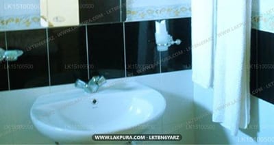 Boulder Range Resort - Modern bathroom sink with black and white tiled wall