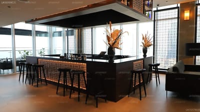 Sofia Colombo City Hotel - modern hotel bar with black counter and woven rattan stools