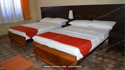 Windswood Villa - two double beds with red runners and dark headboard