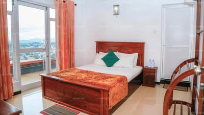Mount Palace - bedroom with mountain view from balcony door