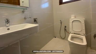 Arches Fort - modern bathroom with sink, toilet, and bidet in stone-colored tones