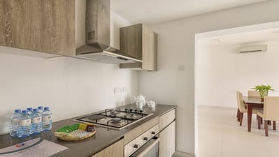 Fairway Sunset - modern kitchen with gas cooktop and wood cabinetry