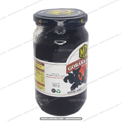 MD Goraka Paste - dark glass jar with red and yellow label, front view showing net weight label