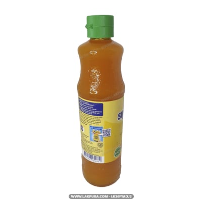 Sunquick Mango - bottle with green cap, front label visible, angled three-quarter view