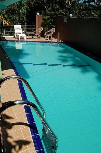 Kandy View Hotel - lap pool with lane dividers and lounge chairs beside