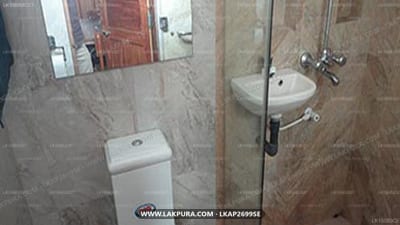 Ocean Studios - modern bathroom with toilet, sink and shower enclosure